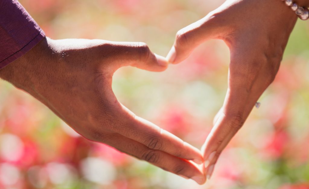 Two hands making a heart